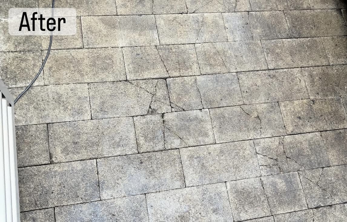Paver surface after pressure washing — clean light grey pavers